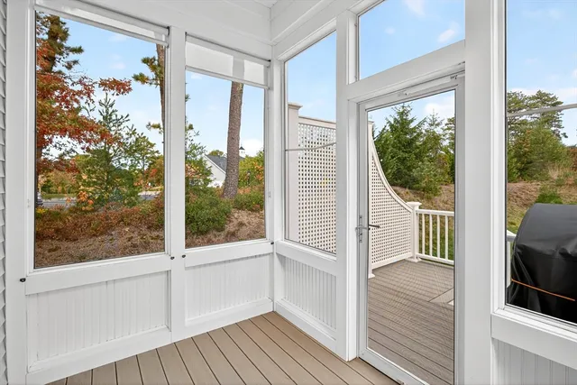 a view of a balcony with wooden floor and outdoor space