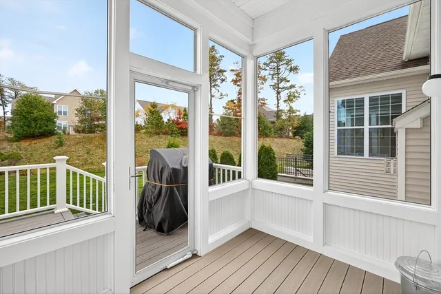 a view of a balcony with wooden floor and fence