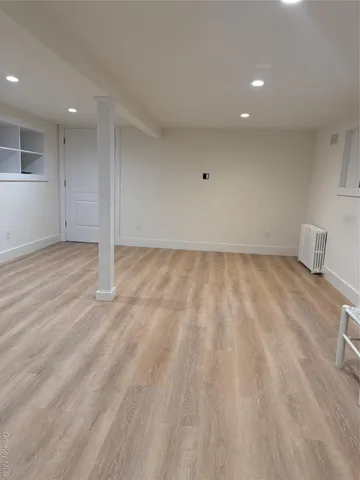 an empty room with a hardwood