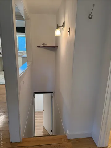 a view of a livingroom with wooden floor