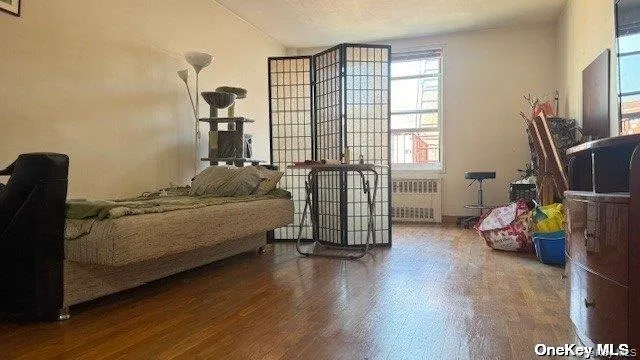 a bedroom with bed and a window