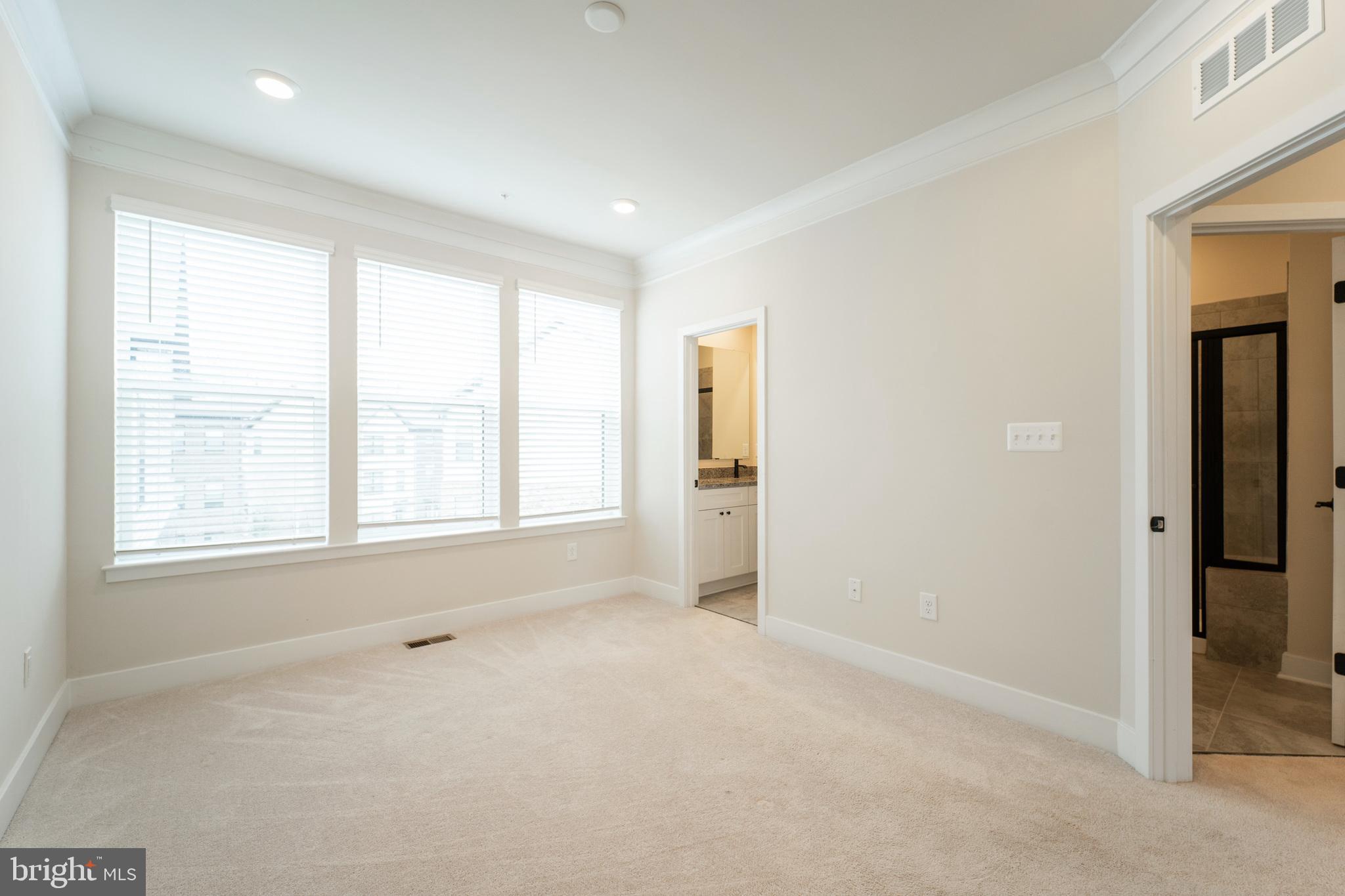 4334 Roland Heights Avenue Baltimore, MD 21211 - Photo 17 of 32 an empty room with windows and closet