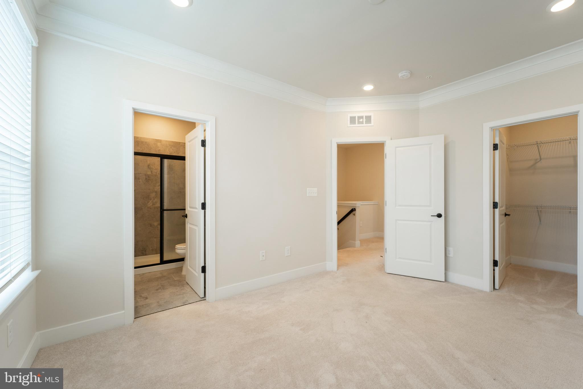 4334 Roland Heights Avenue Baltimore, MD 21211 - Photo 18 of 32 an empty room with closet and a bathroom
