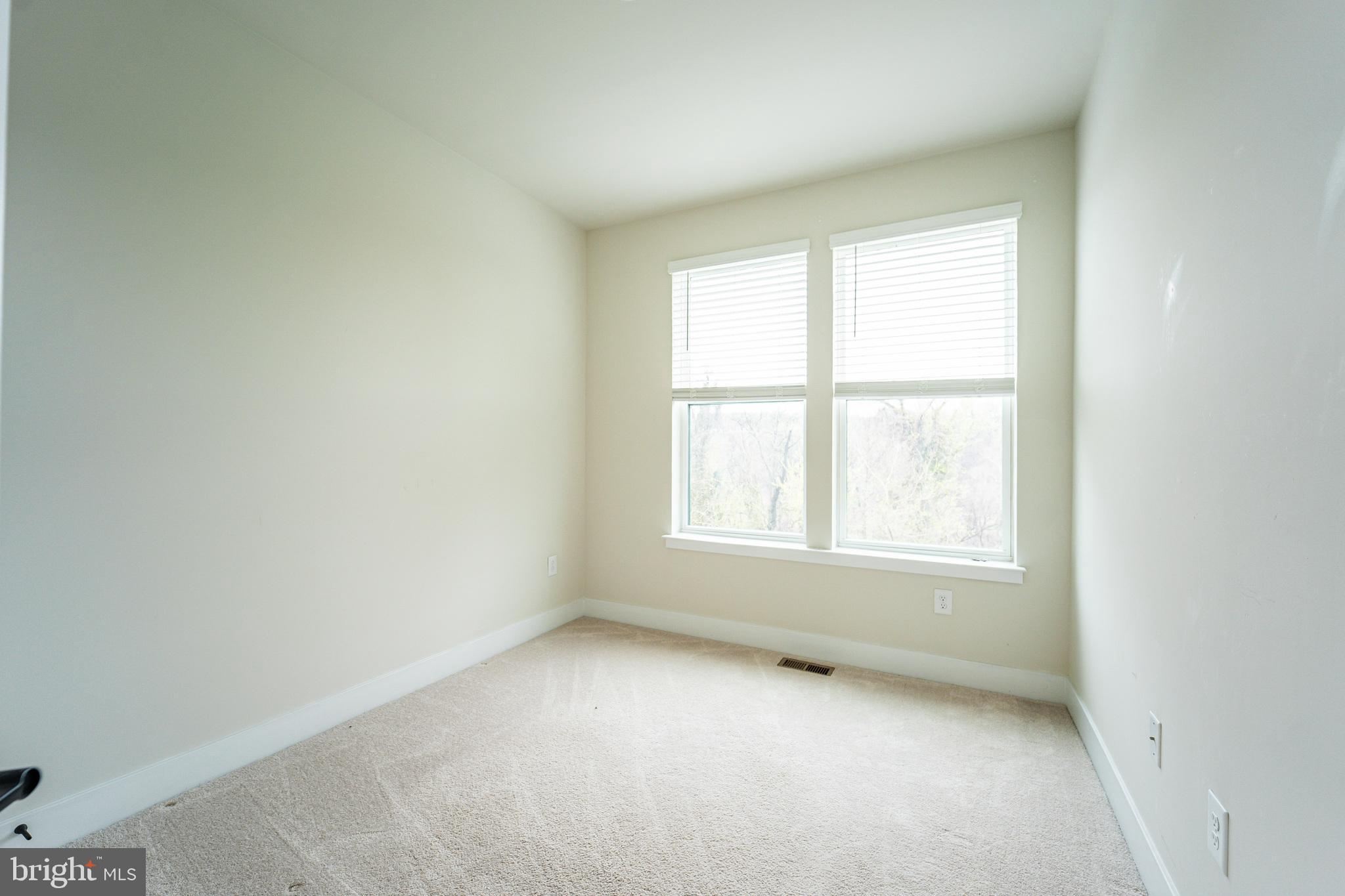 4334 Roland Heights Avenue Baltimore, MD 21211 - Photo 24 of 32 an empty room with a window