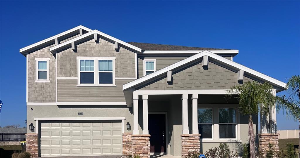 a front view of a house with garage