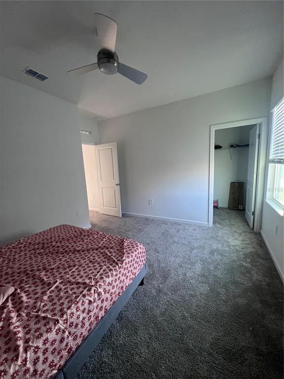 2653 Runners Circle Clermont, FL 34714 - Photo 4 of 13 a bedroom with a bed and a window