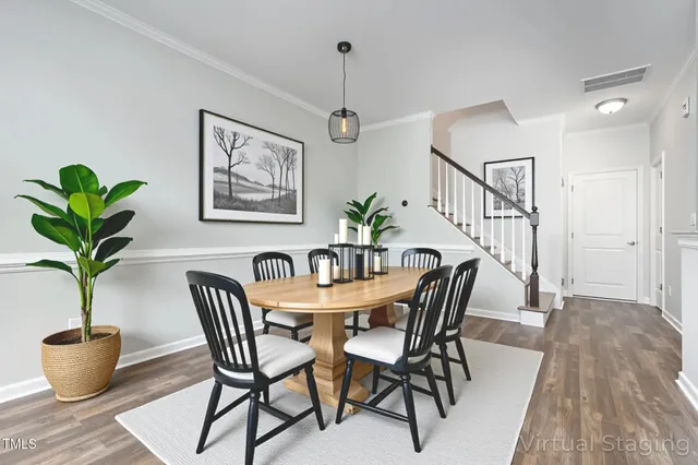 a view of a dining room with furniture window and flowerpot