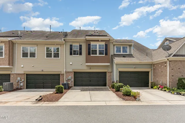 a front view of a house with yard
