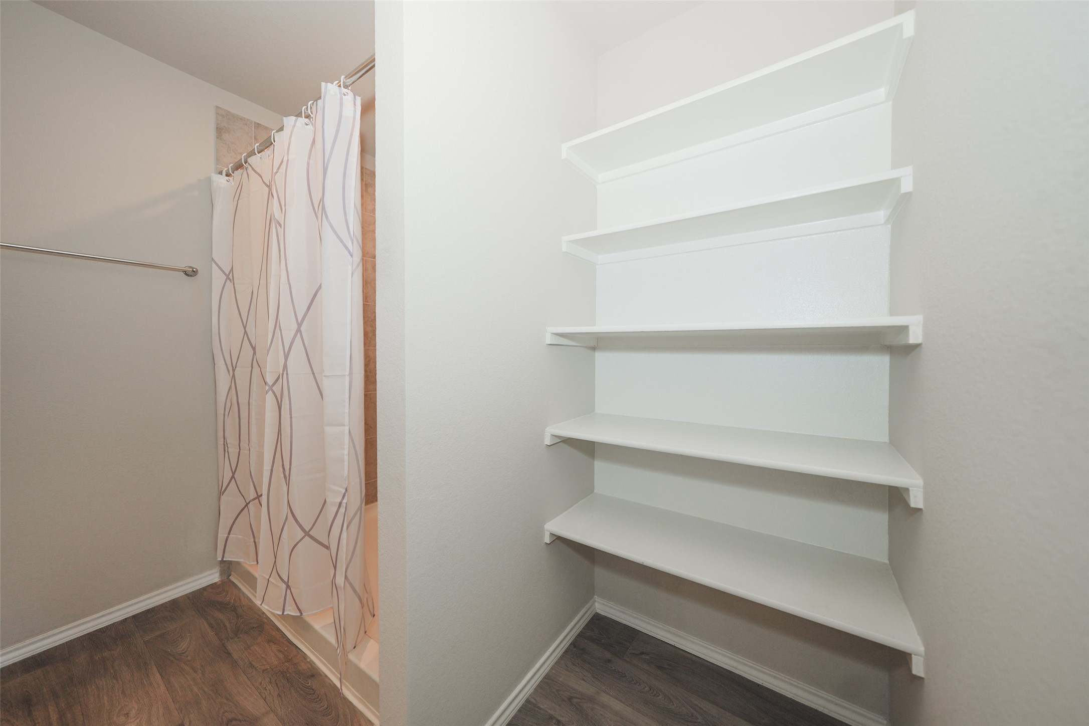 2407 Divot Lane Navasota, TX 77868 - Photo 30 of 37 a view of walk in closet with empty racks