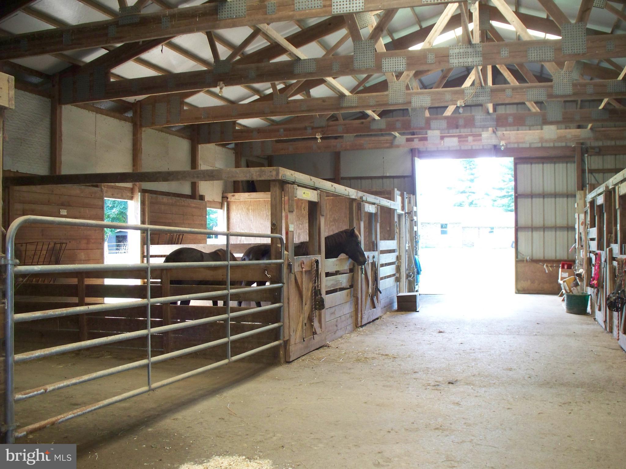 4825 Clermont Mill Road Pylesville, MD 21132 - Photo 23 of 30 Inside of 10-Stall Center Isle Barn