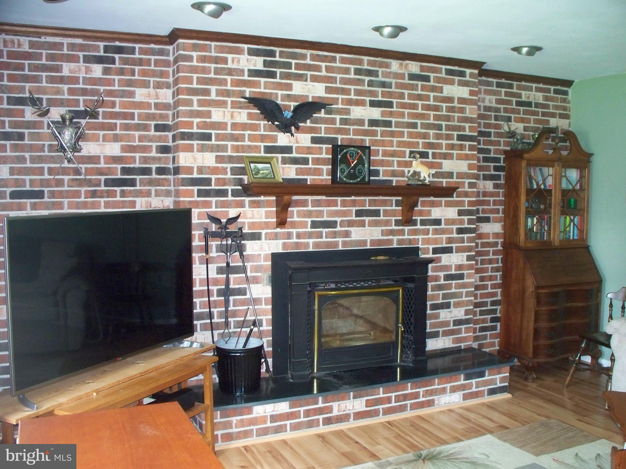 4825 Clermont Mill Road Pylesville, MD 21132 - Photo 7 of 30 Living Room - Raised Brick Hearth Fireplace