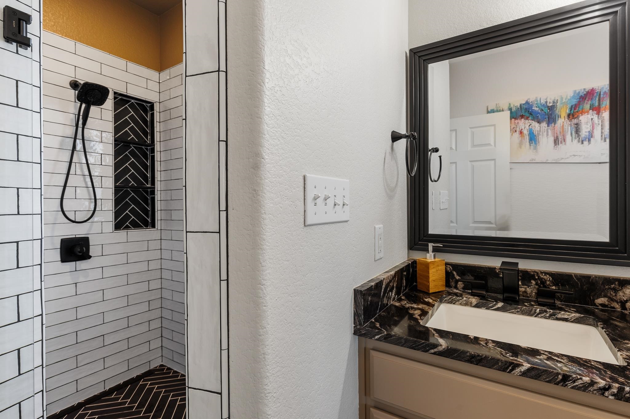 1633 Aztec Kingsland, TX 78639 - Photo 11 of 30 a bathroom with a sink and a mirror