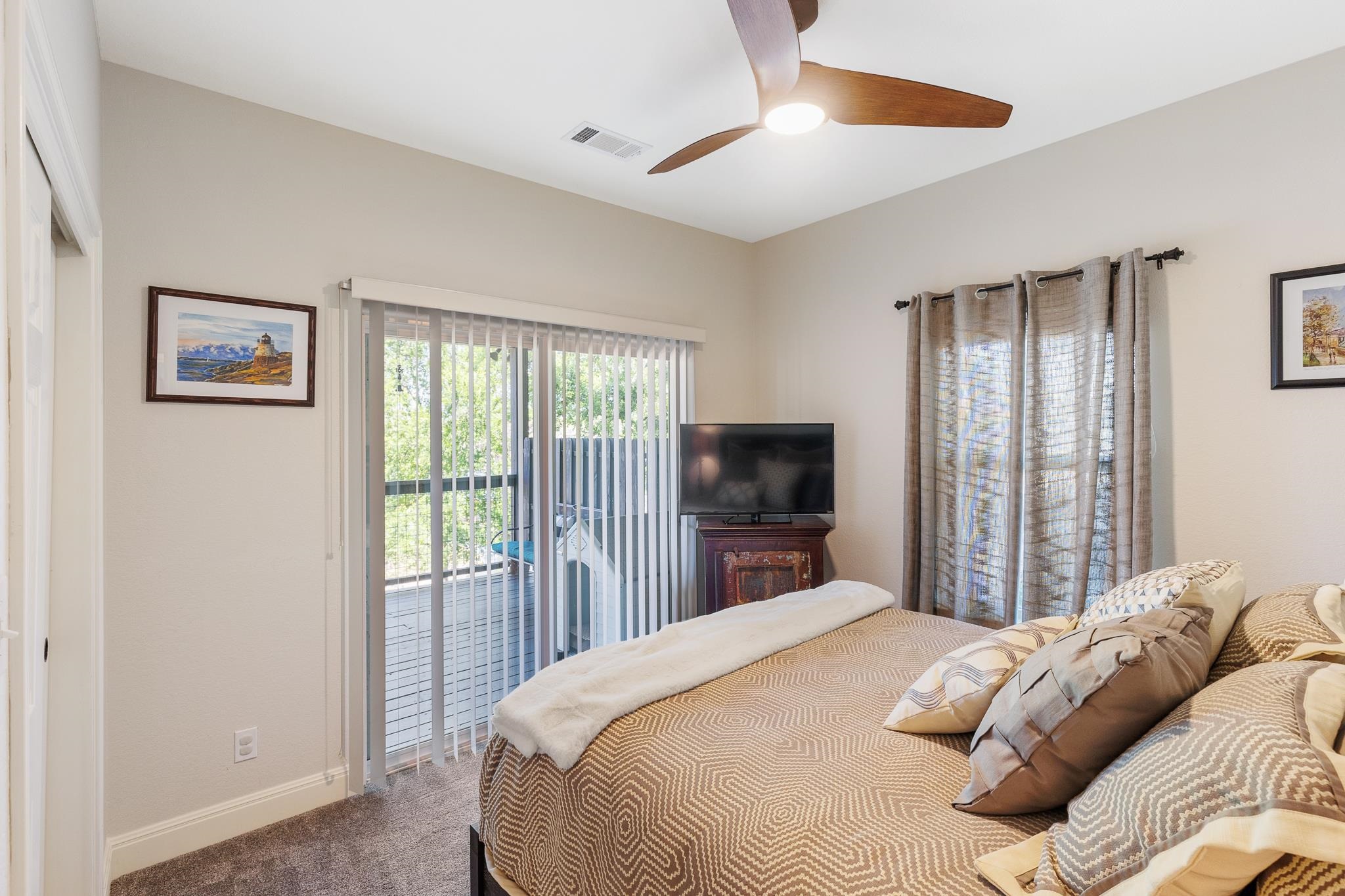 1633 Aztec Kingsland, TX 78639 - Photo 13 of 30 a bedroom with a bed and a flat screen tv