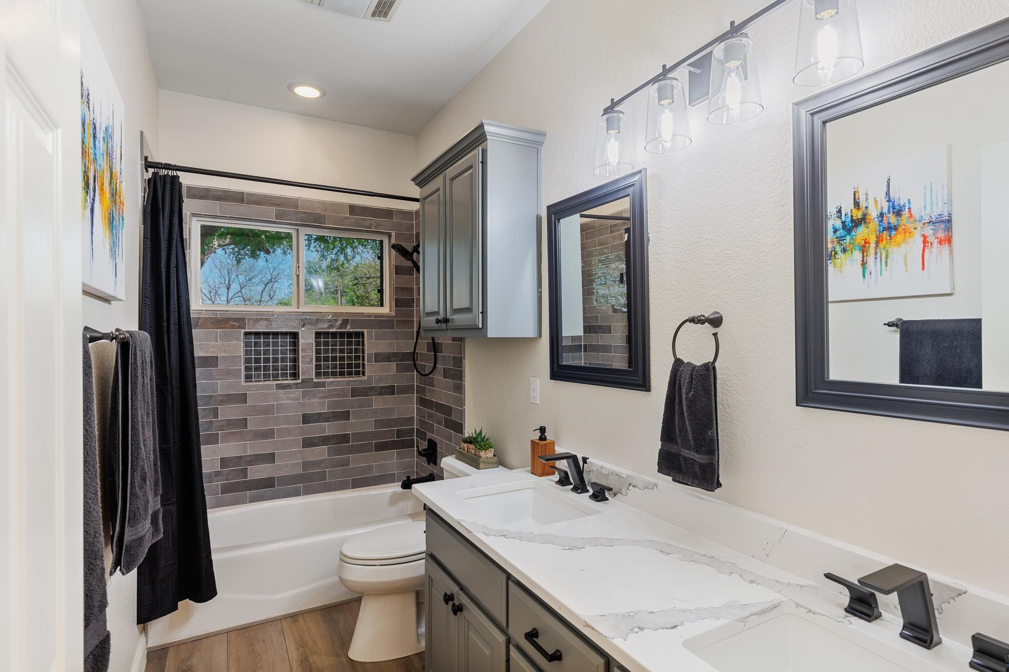 1633 Aztec Kingsland, TX 78639 - Photo 14 of 30 a bathroom with a sink a toilet and shower