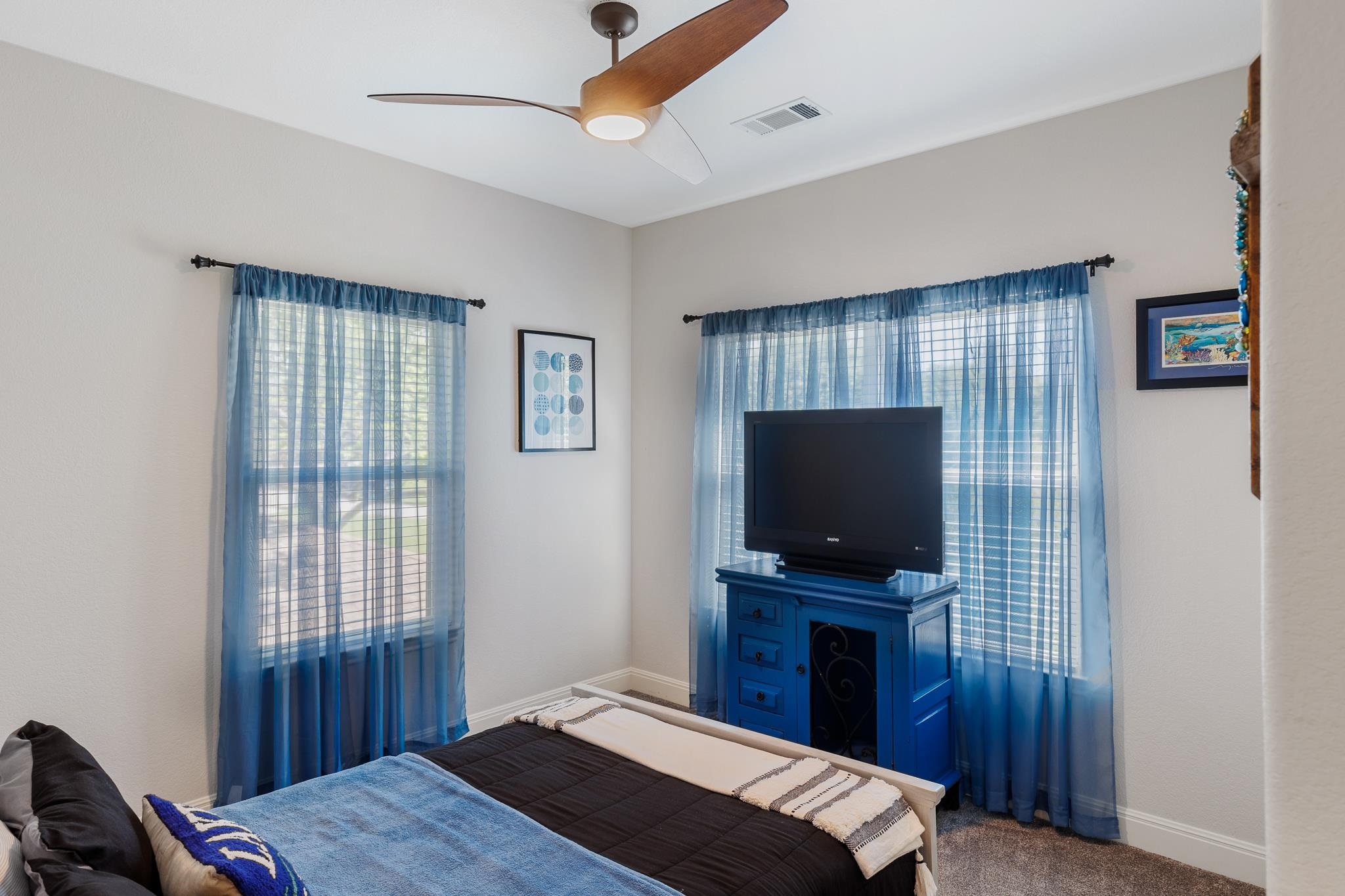 1633 Aztec Kingsland, TX 78639 - Photo 15 of 30 a bedroom with a bed and a flat screen tv