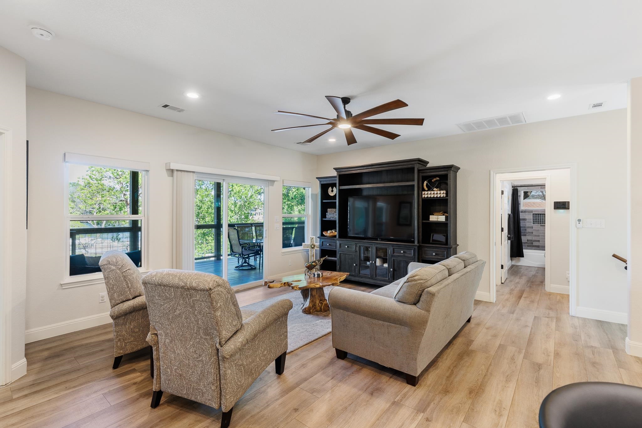 1633 Aztec Kingsland, TX 78639 - Photo 5 of 30 a living room with furniture ceiling fan and a window
