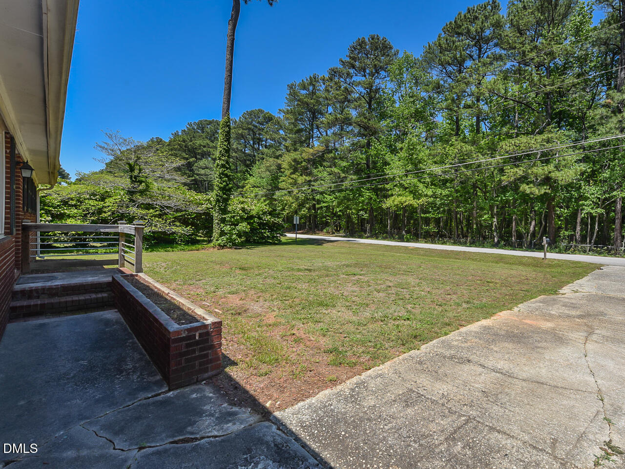 1703 St Patrick Drive Raleigh, NC 27603 - Photo 5 of 29 a view of a backyard with a garden
