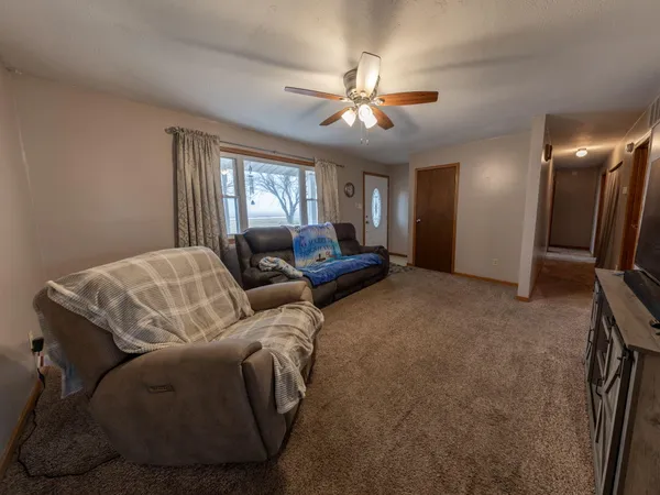 a view of a livingroom with furniture and wooden floor
