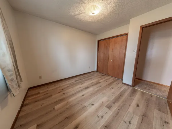 a view of a room that has a bench in it