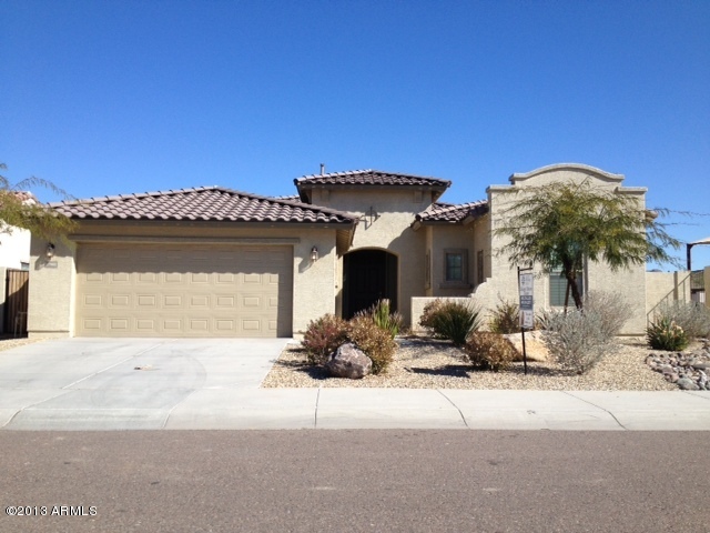 17902 West Verdin Road Goodyear, AZ 85338 - Photo 1 of 10 a front view of a house with a yard