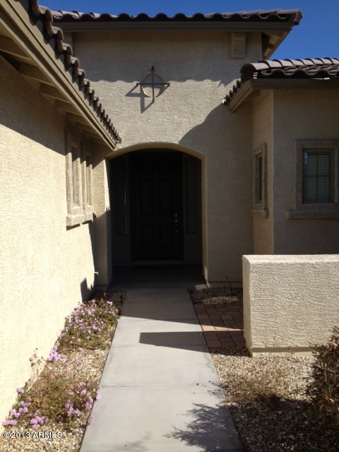 17902 West Verdin Road Goodyear, AZ 85338 - Photo 2 of 10 a front view of a house with a yard