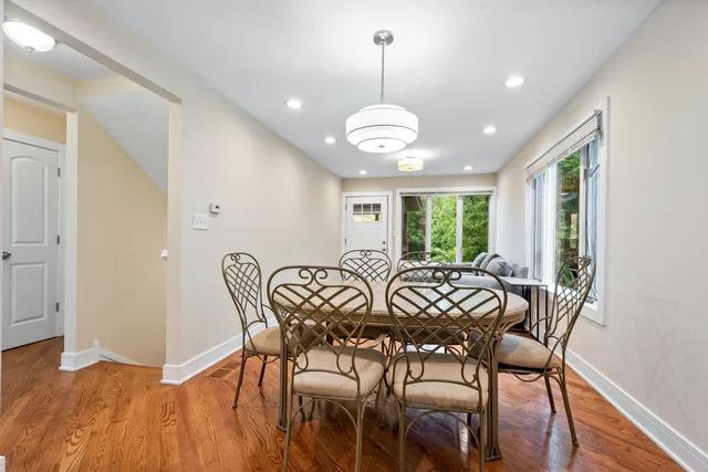 a view of a dining room with furniture window and wooden floor