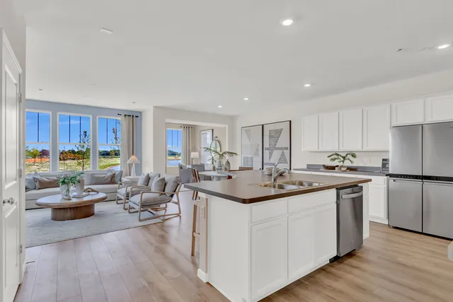 a kitchen with sink and cabinets