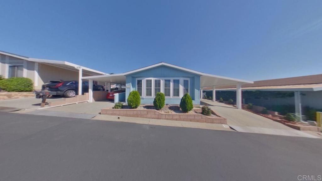 909 Richland Road, Unit 52 San Marcos, CA 92069 - Photo 1 of 28 a view of a building with a street