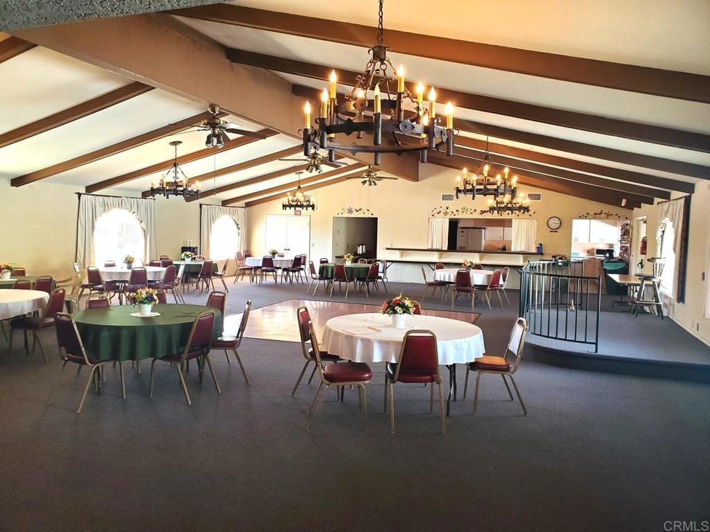 909 Richland Road, Unit 52 San Marcos, CA 92069 - Photo 19 of 28 a view of a dining room with furniture and chandelier