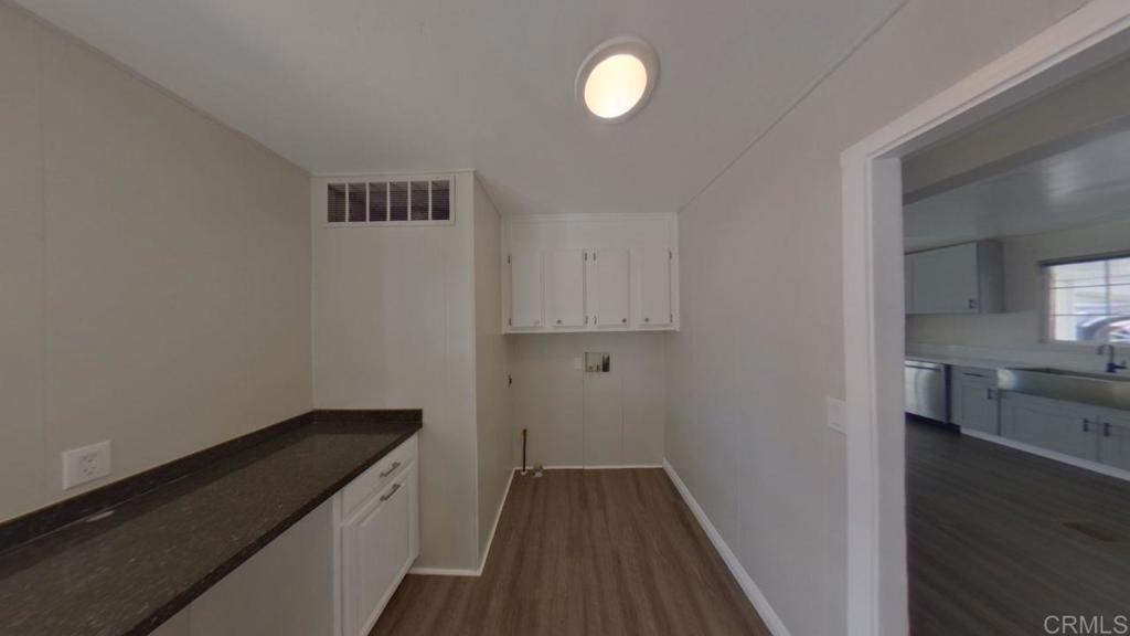 909 Richland Road, Unit 52 San Marcos, CA 92069 - Photo 9 of 28 a view of a kitchen from the hallway