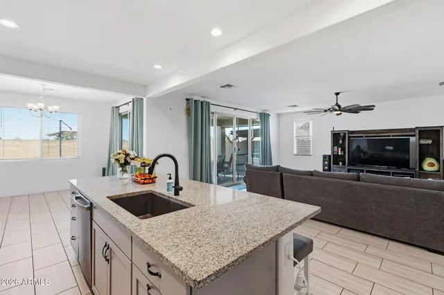 a kitchen with a stove a sink and a refrigerator