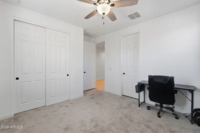 a view of workspace with a window and cabinet