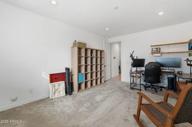 a view of a room with workspace and music instruments