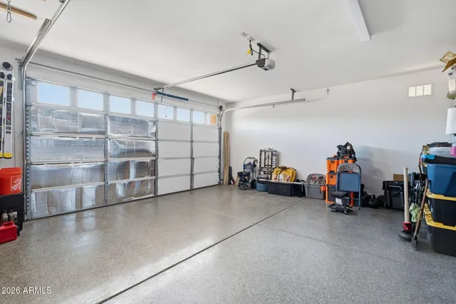 a view of a garage with rack and bicycle