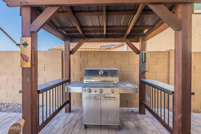 a view of a chairs and table in the balcony