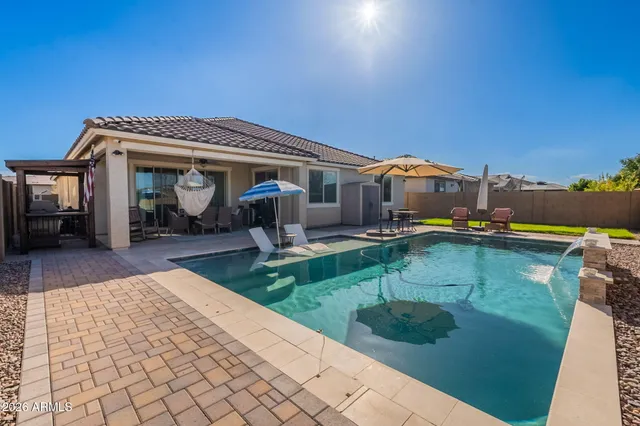 a front view of house with yard and entertaining space