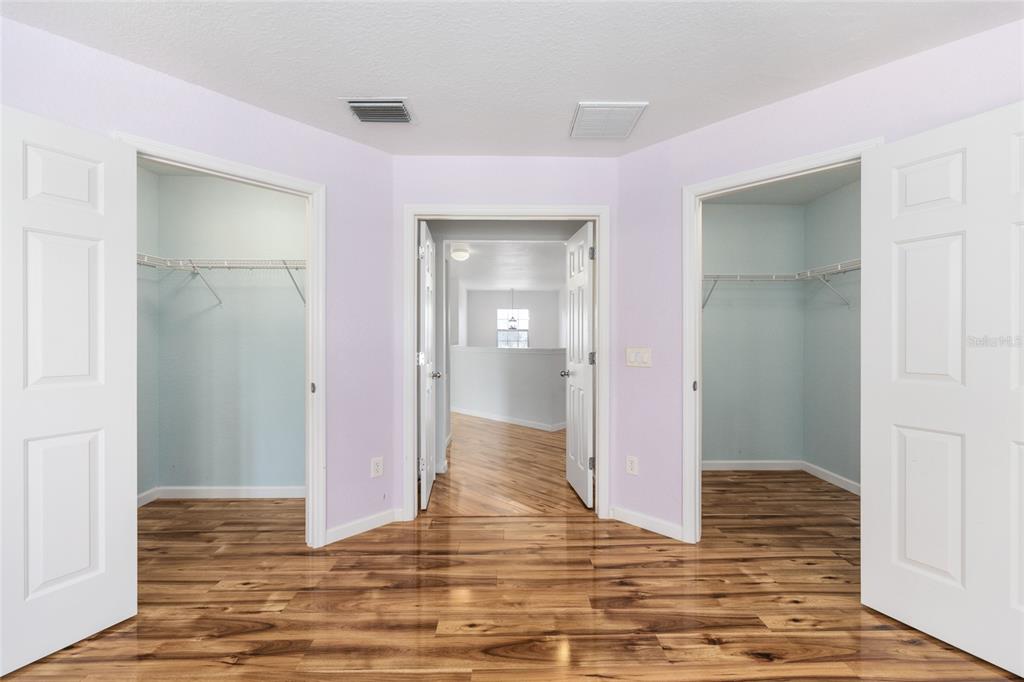 5073 Southwest 40th Place Ocala, FL 34474 - Photo 34 of 53 a view of a bathroom with wooden floor and mirror