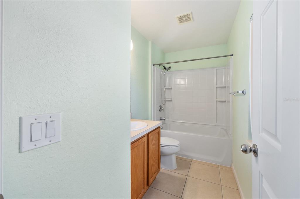 5073 Southwest 40th Place Ocala, FL 34474 - Photo 40 of 53 a bathroom with a shower a toilet and sink