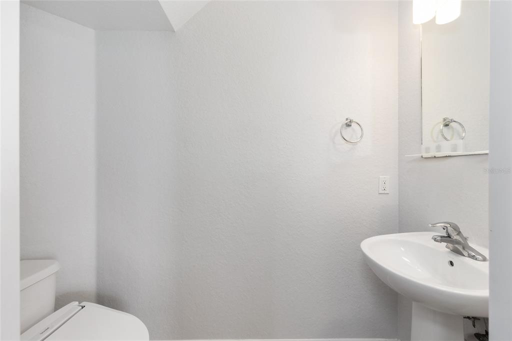 5073 Southwest 40th Place Ocala, FL 34474 - Photo 8 of 53 a bathroom with a sink and a toilet