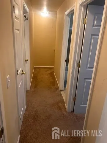 a bedroom with furniture and a chandelier