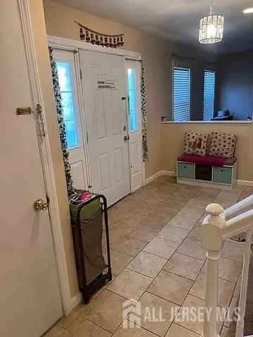 a living room with furniture and a rug