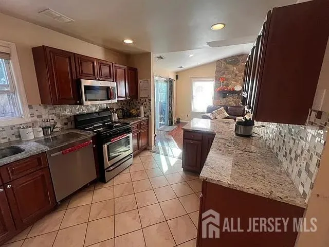 a kitchen with a stove and a microwave