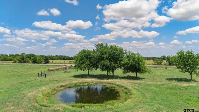 a view of a lake with a yard