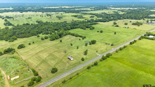 a view of a lake with a yard