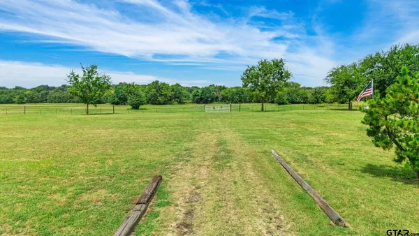 a view of a lake with houses in the back