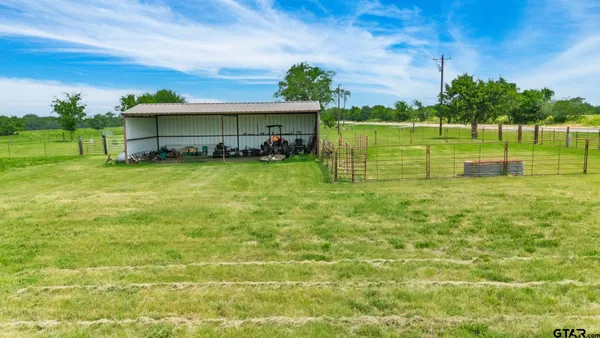 a view of a house with a back yard