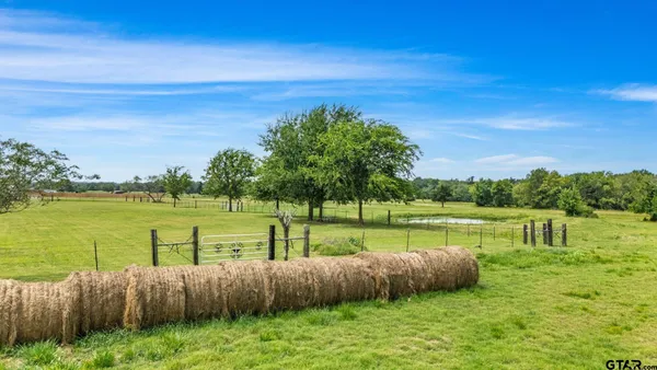 a view of a lake with a yard