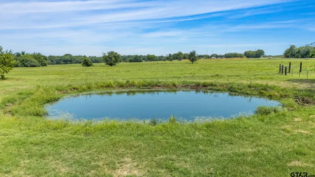 a view of a lake with a yard