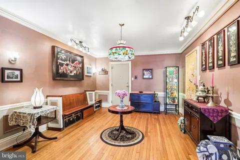 a dining room with a table and chairs
