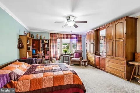 a bedroom with a bed and a walk in closet